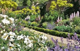 Colourful herbaceous borders in the gardens at Buscot Park