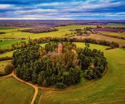 Aerial view of Faringdon Folly Tower on its wooded hilltop above the Vale